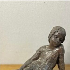 Elegant Bronze Sculpture of a Resting Child
